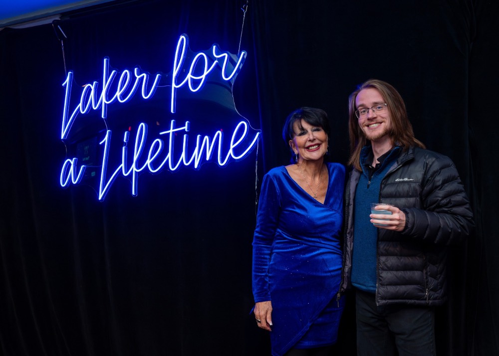 President Mantella poses with a boy in a black jacket